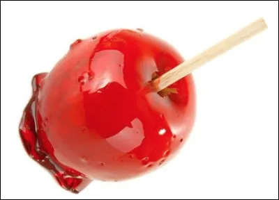 Quelle est cette friandise, une pomme fraîche entourée de sucre caramélisé coloré en rouge vif ?