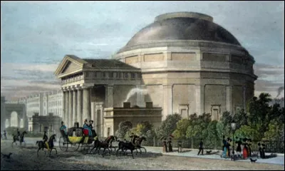 Dans quelle ville le premier ascenseur mécanique public est-il construit en 1829 ?