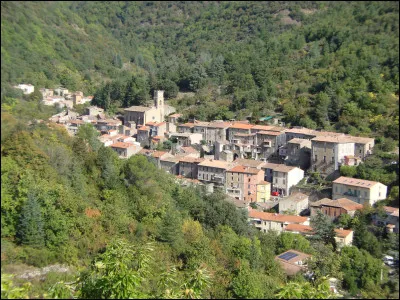 Quel est ce village, situé près de Bédarieux, centre minier sur un petit bassin houiller exploité en galeries puis en découverte jusqu'en 1994 ?