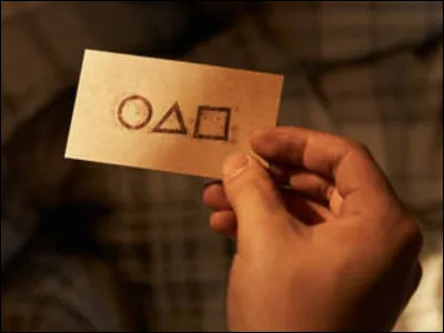 Quels symboles sont présents sur linvitation au Squid Game ?