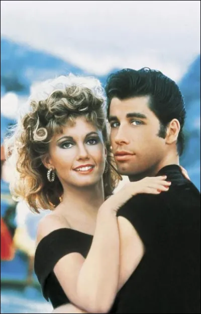 À quel genre appartient le film Grease qui suit la relation entre Danny Zuko et Sandy Olsson ?