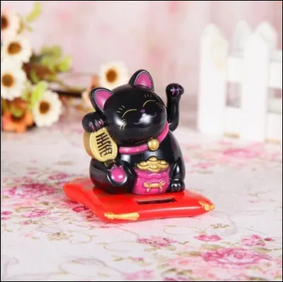 Que symbolise un maneki-neko noir ?