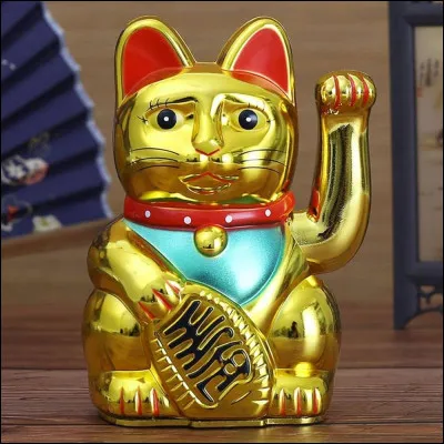 Quelle est la signification du maneki-neko doré ?