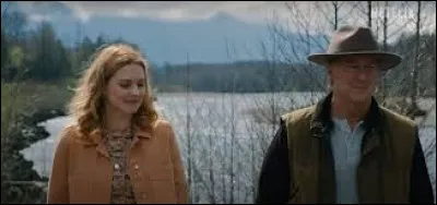 Comment Mel apprend-elle l'existence de son père biologique ?