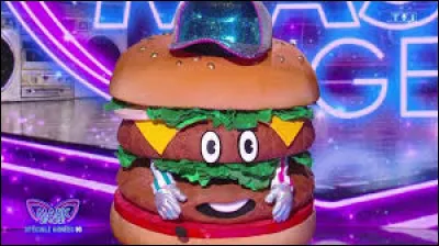 Un enquêteur express est venu sur le plateau de "Mask Singer" le vendredi 30 mai 2025 sous le costume du burger pour aider les 4 enquêteurs, mais qui était sous le costume du burger ?