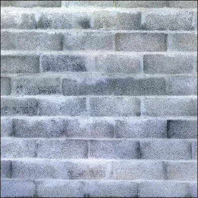 Comment appelle-t-on un élément de maçonnerie taillé afin de réaliser les deux faces opposées dun mur ?