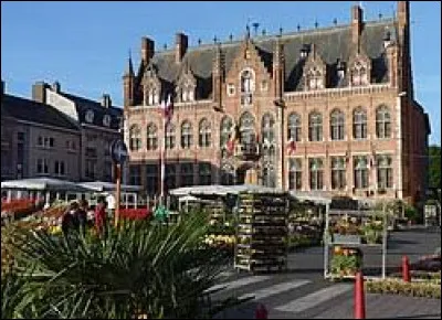 Quelle est cette ville belge de 60 000 habitants, limitrophe de la ville française de Tourcoing ?