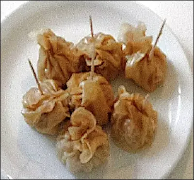 Quel est le nom de ces pâtes farcies de viande de porc ou de poulet, originaire de la Réunion ?