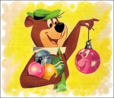 Qui est en train de se regarder dans une boule décorative de Noël ?