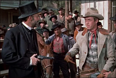 L'homme sur la gauche de la photo s'empare du troupeau de vaches appartenant au personnage de James Stewart. Quel est son m&eacute;tier ?