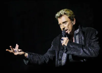 Dans quelle chanson Johnny Hallyday chante-t-il que son corps est "lourd comme un cheval mort" ?