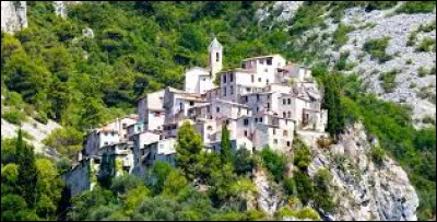 Quel adjectif qualifie un village nich&eacute; au sommet d'un relief isol&eacute;, en position dominante ?