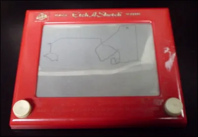 Quel est le nom de cette tablette sp&eacute;ciale qui permet aux enfants de dessiner au moyen de deux boutons &agrave; tourner contr&ocirc;lant le d&eacute;placement d'un stylet ?
