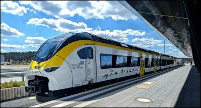 Quelle chanson de Joe Dassin parle d'un train qui s'en va ?