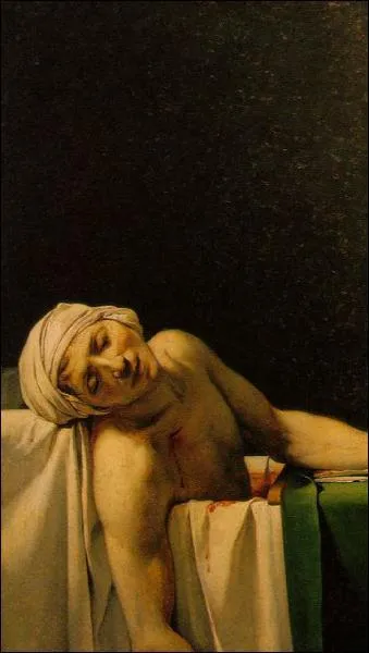 Que tient Marat dans sa main gauche ?