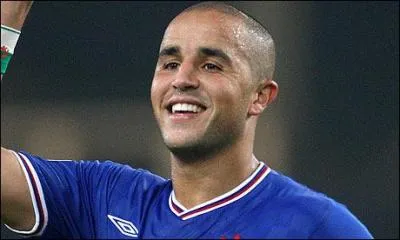Dfenseur algrien, il a remport le titre de Champion d'Ecosse 2011 avec les Glasgow Rangers, dont il est l'un des joueurs majeurs