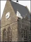 On peut voir sur le clocher de l'glise de cette commune un manequin reprsantant le soldat John Steele. Quelle est cette commune ?
