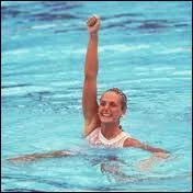 Championne olympique en natation synchronise, elle travaille ensuite au Cirque du Soleil