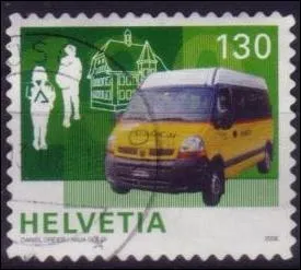 Quelle est la marque de ce camion en version , servant au ramassage scolaire en Suisse, visible sur ce timbre de Suisse ?