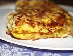 Quelle est cette omelette sucre garnie de pommes dores au beurre et crme et flambe au Calvados ?