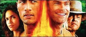 Dans quel film de 2003 avec The Rock et Christopher Walken joue-t-il le patron du bar  Camo  ?