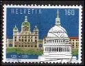 Dans quelle ville Helvte est install le palais fdral visible sur ce timbre de Suisse ?