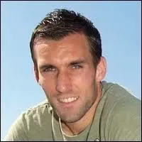 Dans quel club étranger a évolué Anthony Reveillère en 2003 ?