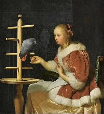 Jeune femme nourrissant un perroquet