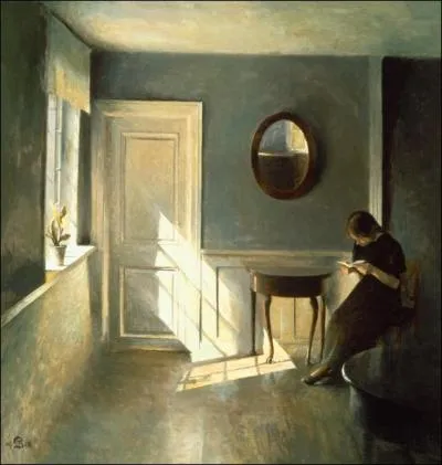 Girl reading a letter in an interior