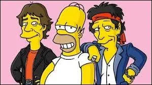 Avec quel groupe Homer pose-t-il ?