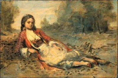 Algrienne couche sur le gazon.