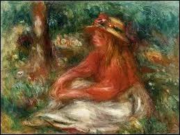 Jeune fille assise sur l'herbe.