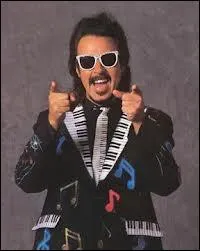 Quel objet est devenu indissociable de Jimmy Hart, faisant sans aucun doute de lui l'un des plus clbre et mythique manager de l'histoire de la WWE ?
