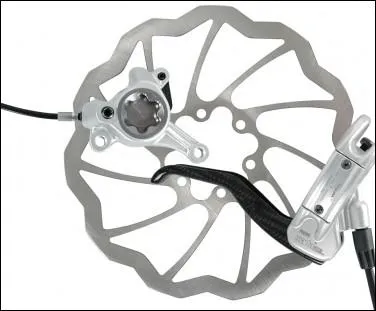 Quelle est la particularit du fluide utilis par les freins  disque hydraulique ?