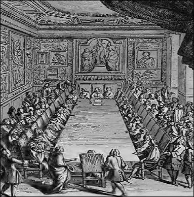 Quand les séances de l'Académie française se tenaient au Louvre, au milieu de la salle, se trouvait une grande table où s'étalait un tapis vert entourée de chaises en noyer recouvertes de "mocade".