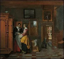 Intrieur avec une femme prs d'une armoire  linge.