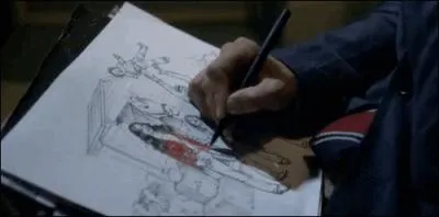 Qui dessine ? (Sur la photo)