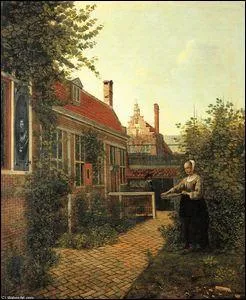 Femme avec un panier de haricots dans le potager.