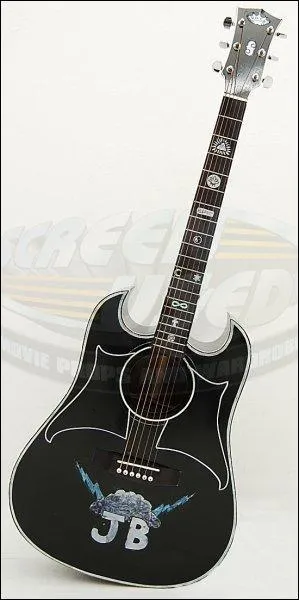  qui appartient cette guitare ?