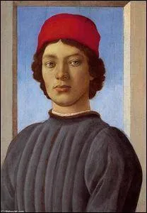 Portrait d'un jeune homme avec chapeau rouge.