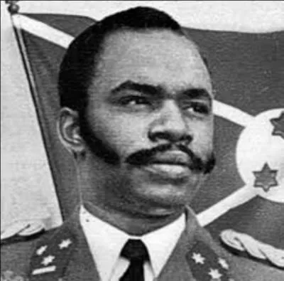 Son pays devient indépendant du royaume de Belgique également le 1er juillet 1962. Il est Tutsi, ethnie minoritaire, renverse le roi Ntaré V, proclame la République du Burundi et en devient le président le 28 novembre 1966.