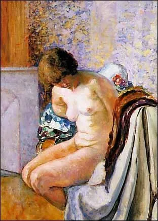 Femme nue assise prs de la chemine.