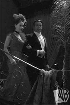 Cette image reprsente Phoebe et Drake dans le cabaret fantme qui s'enflamme tous les jours. Dans ce cabaret, Phoebe porte une trs jolie robe...