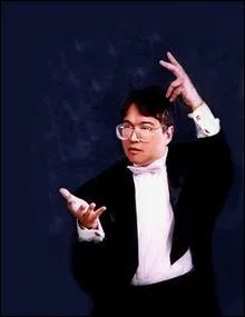 Compositeur n en 1952, il est galement trs connu comme crivain de science-fiction et cuisinier. En musique, il a sign 5 symphonies, le ballet  Kaki , un requiem pour les victimes du 11 septembre, 5 opras, des musiques de films, une cantate en hommage  Mountbatten. 