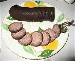 Cette andouille fait la rputation d'une ville de Normandie. C'est l'andouille de ...