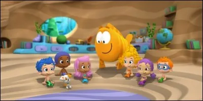 Dans "Bubulle Guppies", comment se nomme le professeur qui accompagne Molly, Phil, Dina et Luna ?