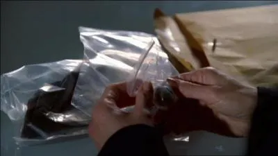 Quel objet retrouv avec le corps de Christine Brennan appartient  Russ ?