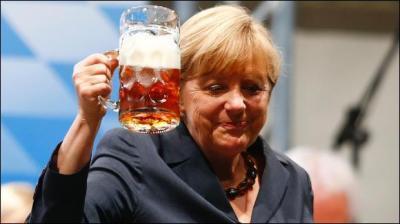 Quel est le rôle d'Angela Merkel au 1er mai 2014 ?