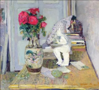 Statuette de Maillol et roses rouges.