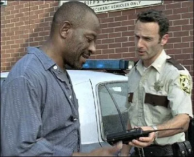 Comment s'appelle le père de Duane, que Rick rencontre après être sorti de l'hôpital ?